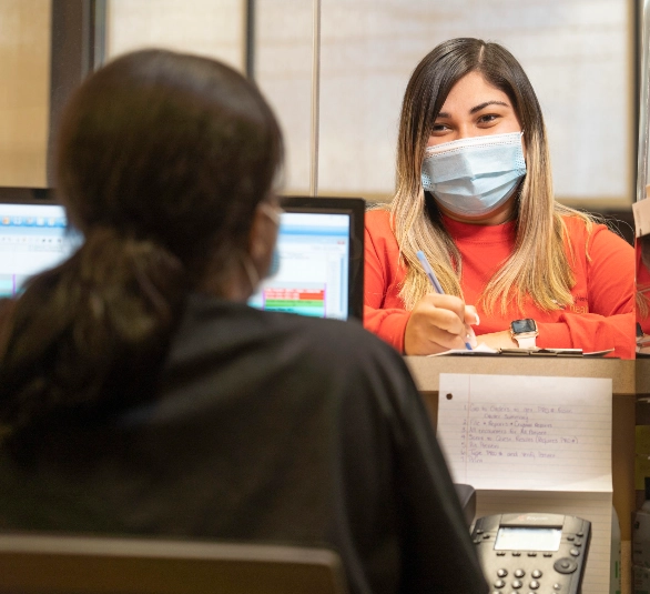 Neighborhood Health staff consulting with patient